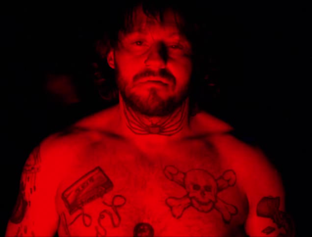 A man is covered in tattoos