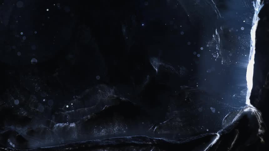 Dark abstract fluid expanding in slow motion