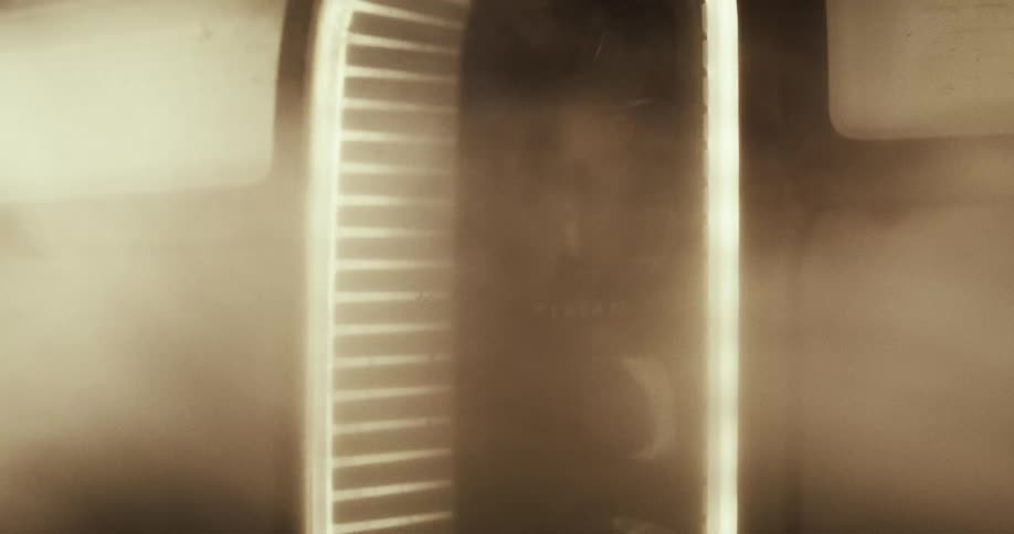 A vehicle driving through clouds of dust