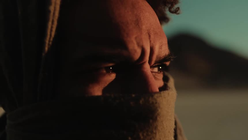 A close up clip of a man covering his nose