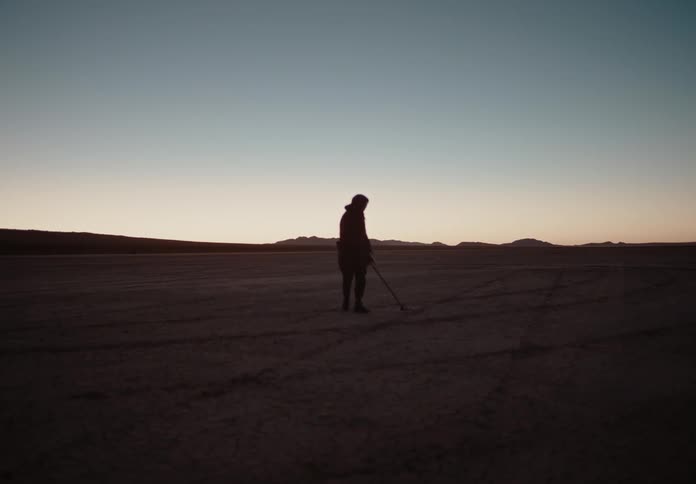 A clip of a man scanning the soil