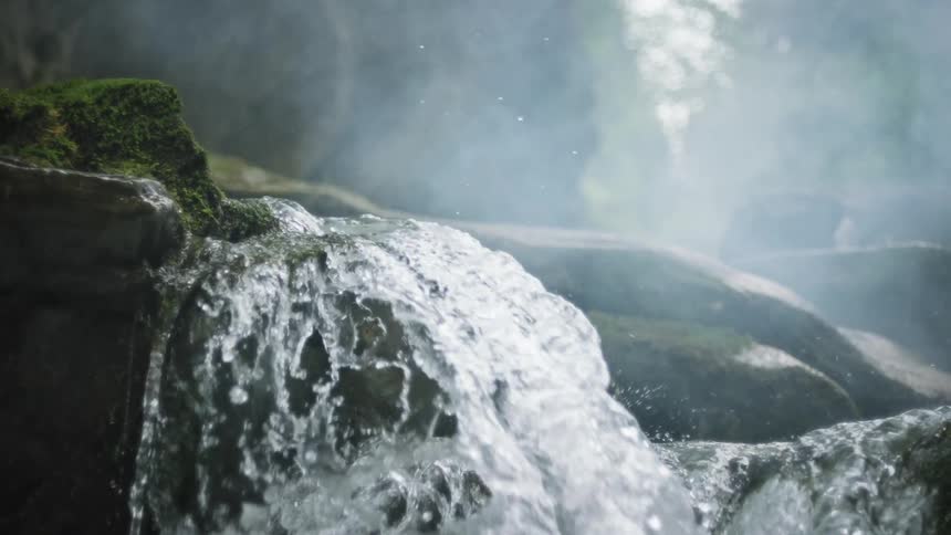 Water cascades over rocks