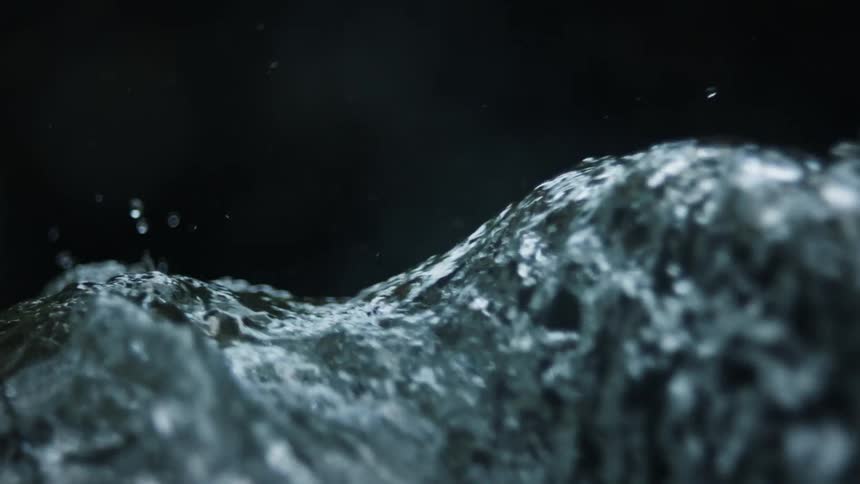 The stream moves fast over the rocks