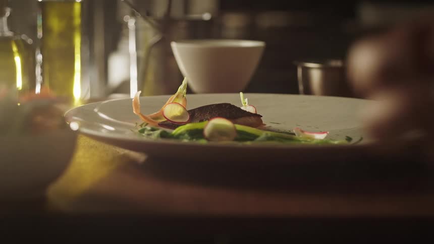 A man prepares a salad