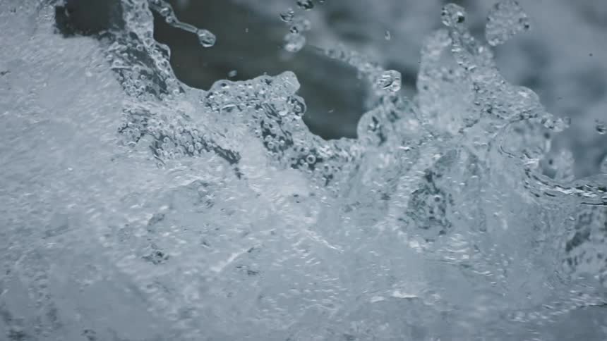 Close up of water in motion splashing on a river
