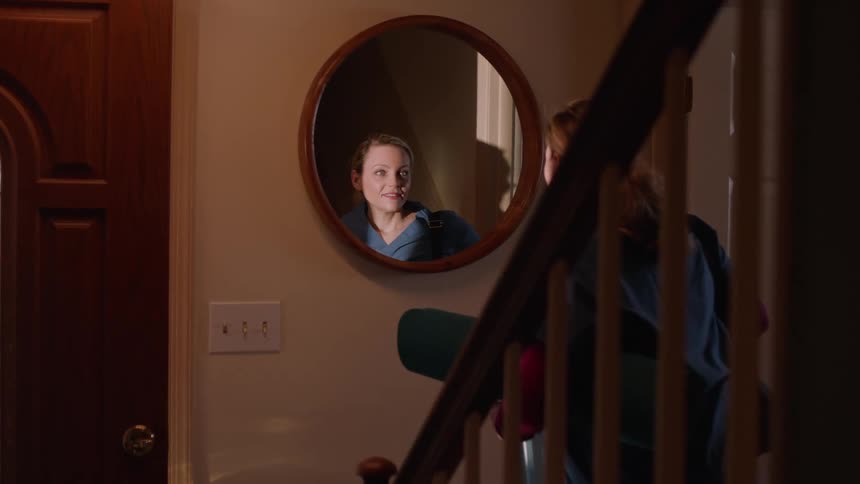 A clip of a lady going out of her house