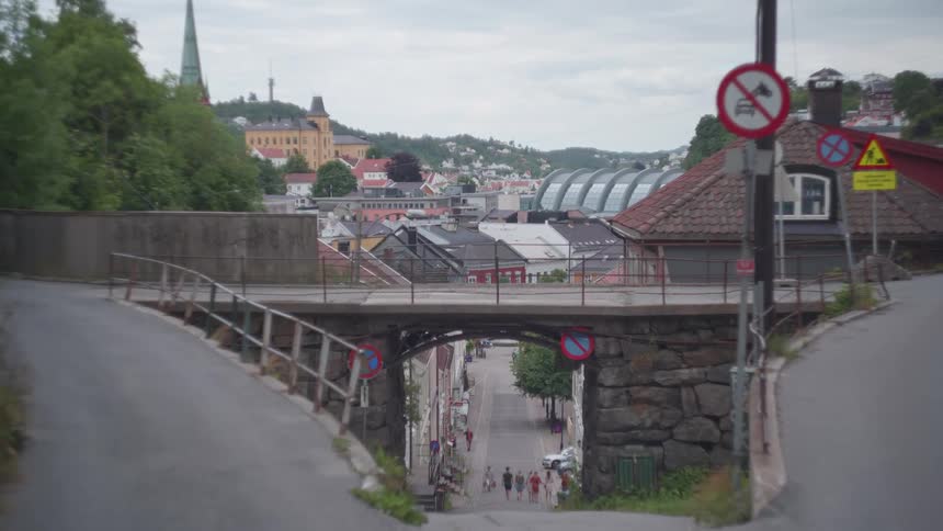 Panorama of a hilly street in a neighborhood in the city on a cloudy day