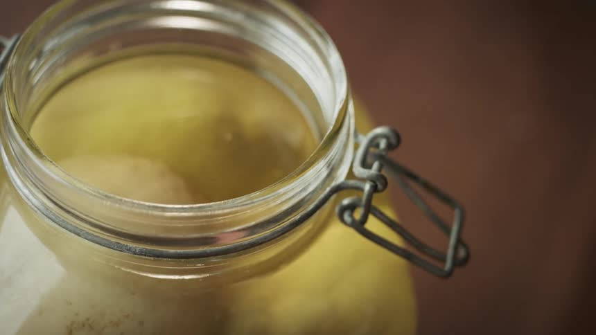 A clip of a person opening a jar
