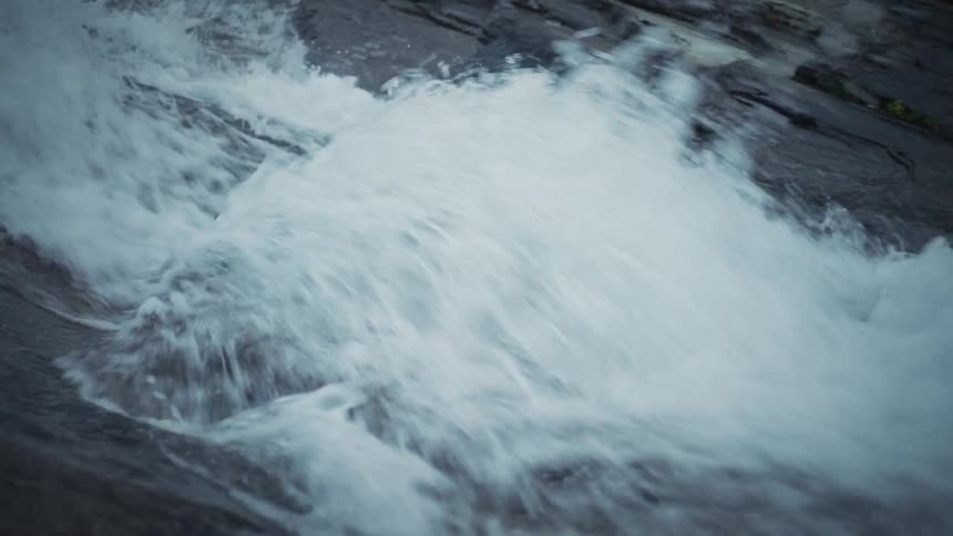 A stream foams over a rapid
