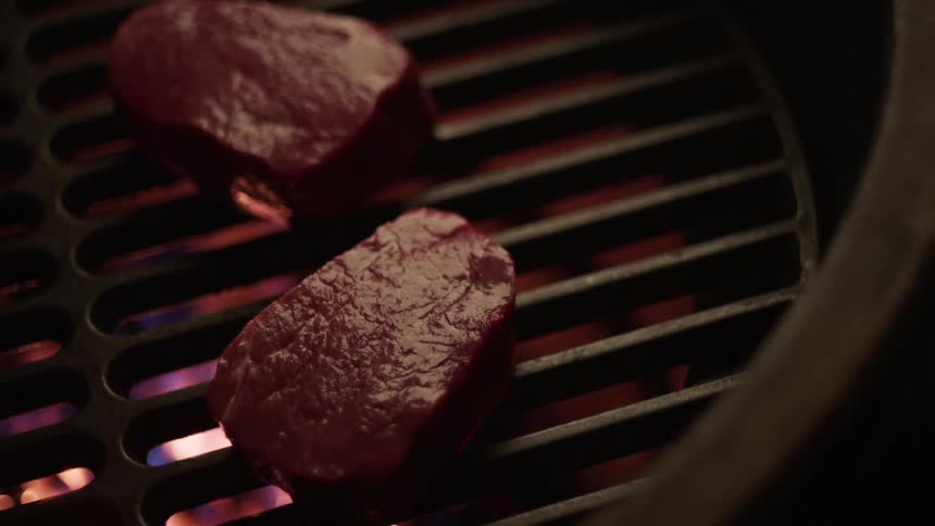 A steak placed on a grill