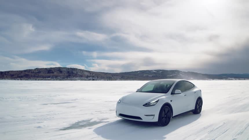 Ane electric car driving on frozen lake