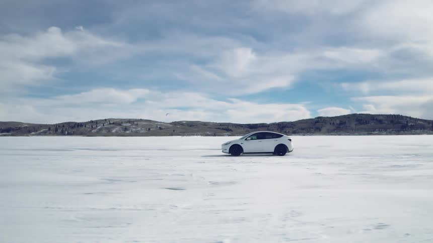 Electric car drives on a frozen lake