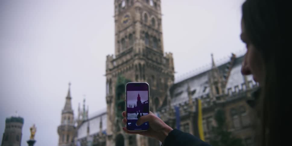 A clip of a lady recording the cathedral with a smart phone