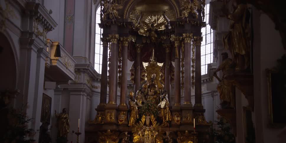 Two men sit in a church