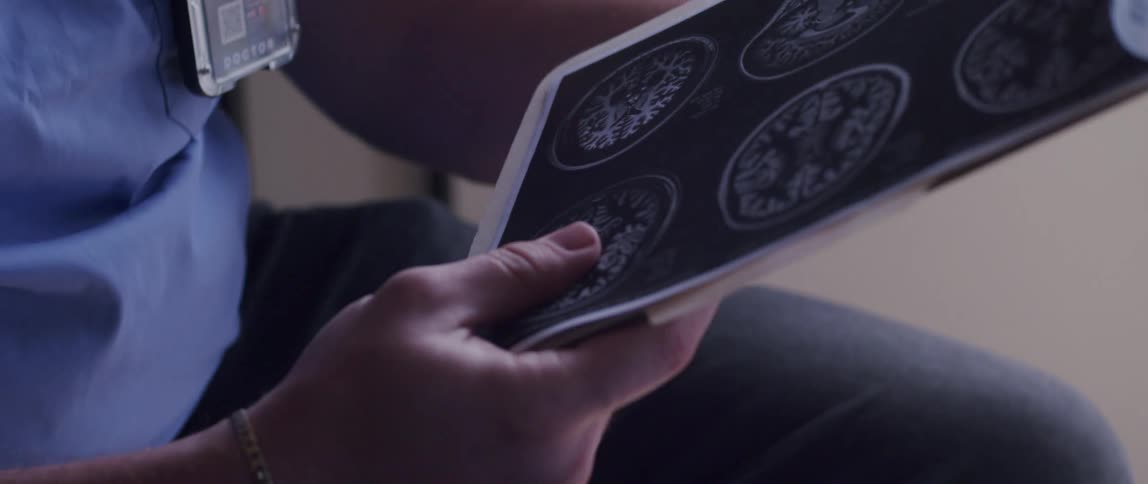 Male healthcare professional going through medical paperwork