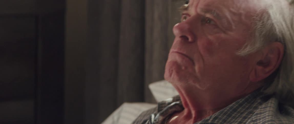 Portrait of an elderly man with teary eyes