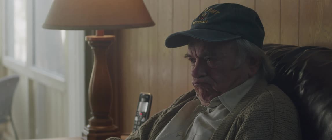 An elderly man breaks down while discussing something