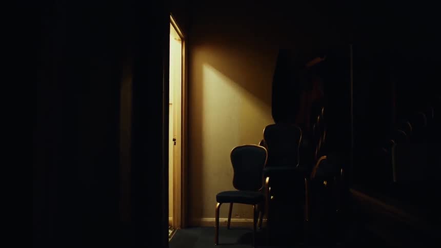 A chair and other furniture in a hallway