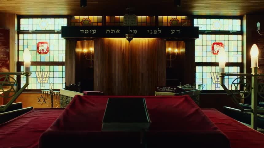 An alter with a book on it in a synagogue