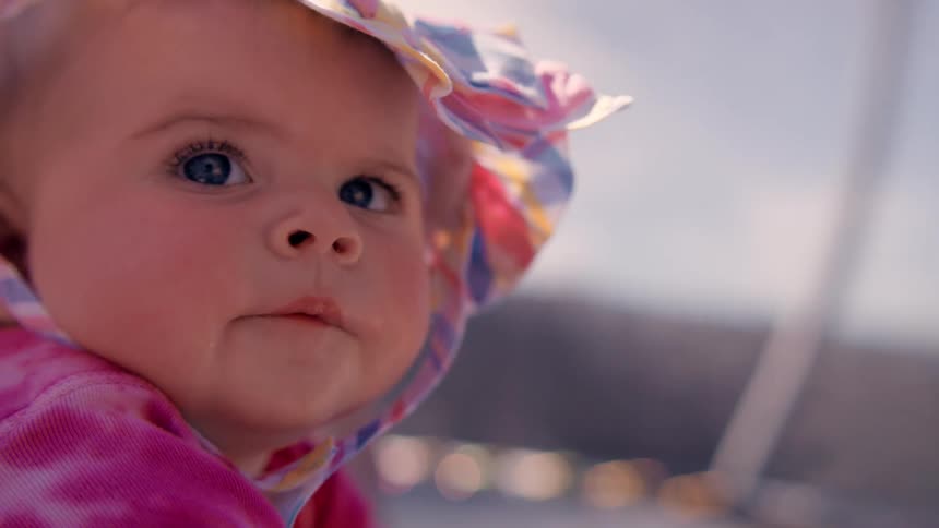 A baby wearing a bonnet