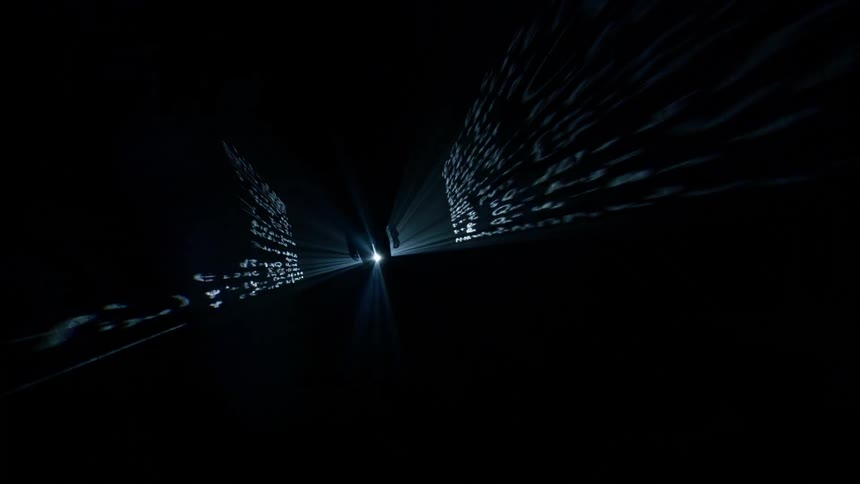 Silhouette of a person walking in a studio hallway with cinematic lightings
