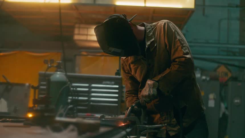 A welder is welding metal