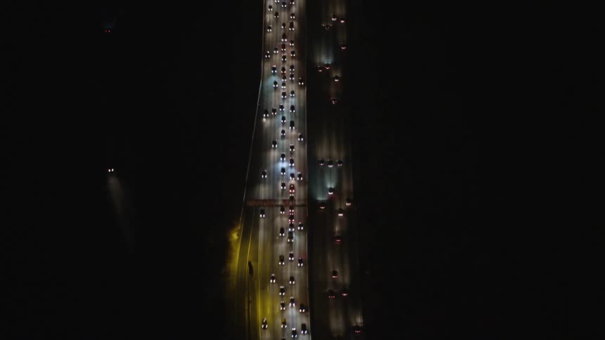 Aerial panorama of traffic on a highway at night