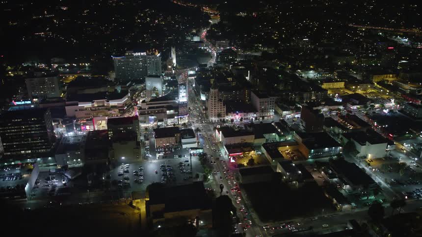Traffic is driving through the city at night
