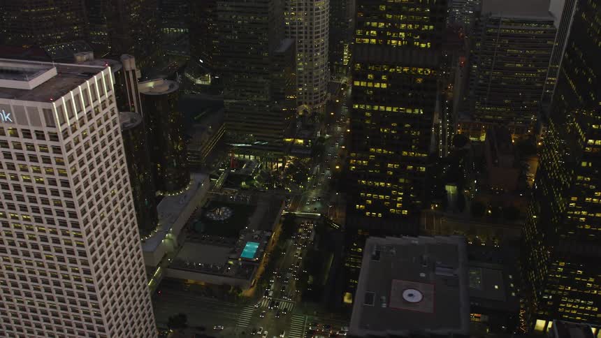 Varying levels of traffic on city streets at dusk
