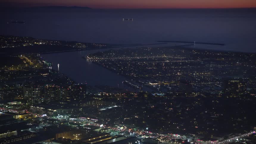 Aerial view of a coastal city at night