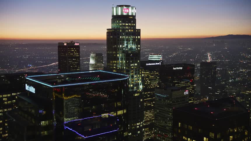 A night aerial clip of a city and high buildings