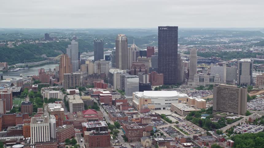 Aerial panorama of a metropolis with urban areas and skyscrapers with a river canal