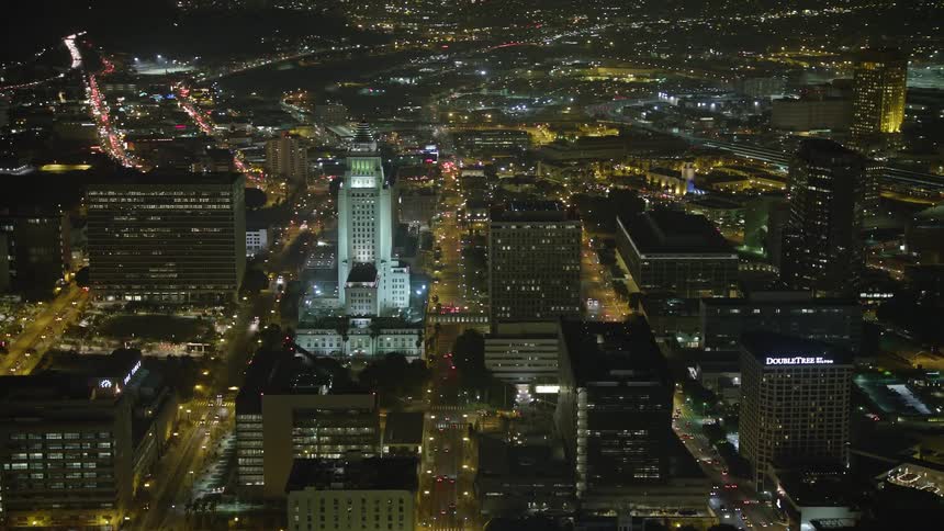 City hall and the citys skyscrapers at night in downtown los angeles