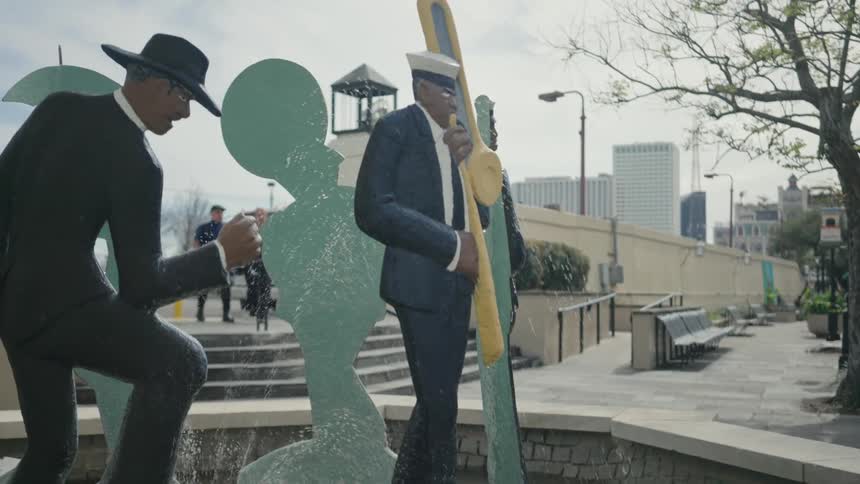 A water fountain with sculptures of a jazz band playing instruments