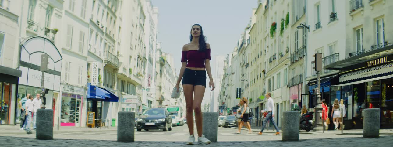 A woman poses in the street