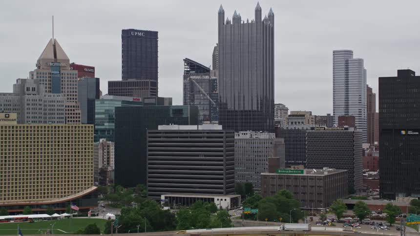 Aerial panorama of modern commercial buildings in a seaside metropolis on a cloudy day