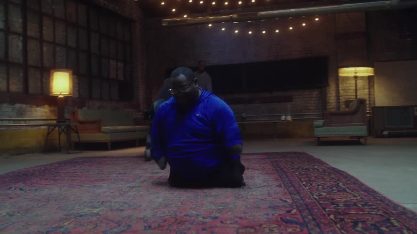 A handicapped man dances on a rug