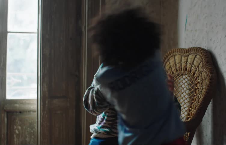 A father and his son play inside