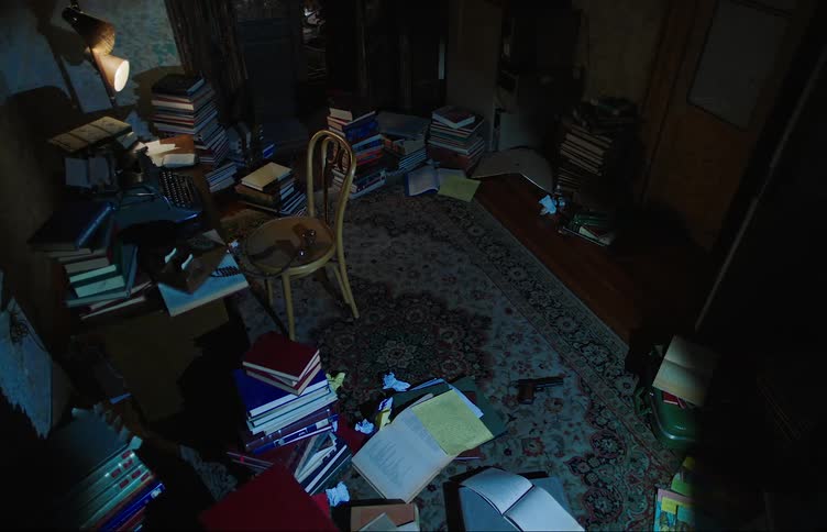 A flashlight scans a cluttered room