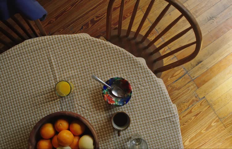 Young person crawls under table as the room shakes