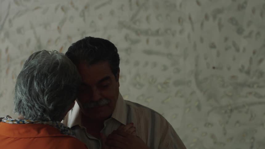 A couple are dancing together