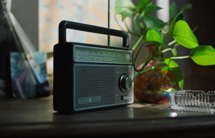 Radio and other items on a table tremble during an earthquake