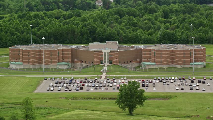 A building and parking lot in a rural area