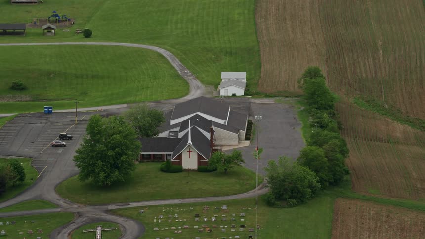 Aerial view of a small church in the countryside
