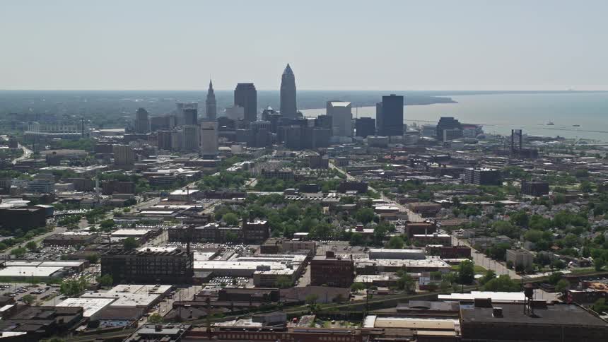 Aerial panorama of a metropolitan city with a skyscraper by the sea