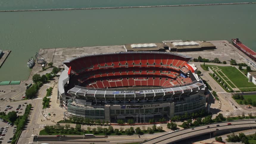 A stadium in a city on a coast