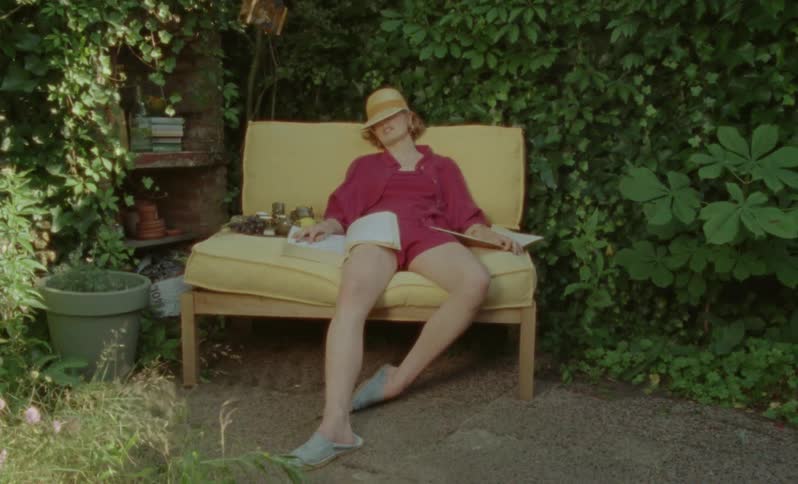 A woman is sleeping in her yard
