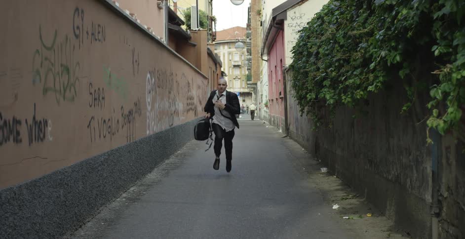 A person running down an alley