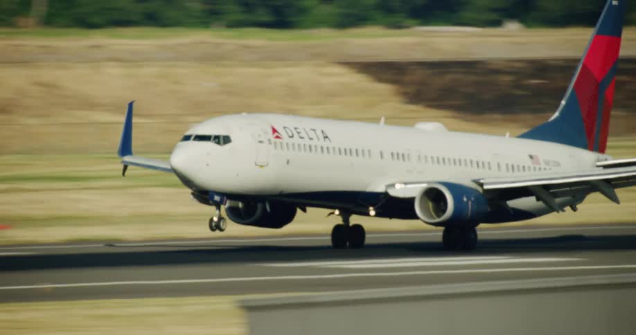 Commercial plane landing on a runway