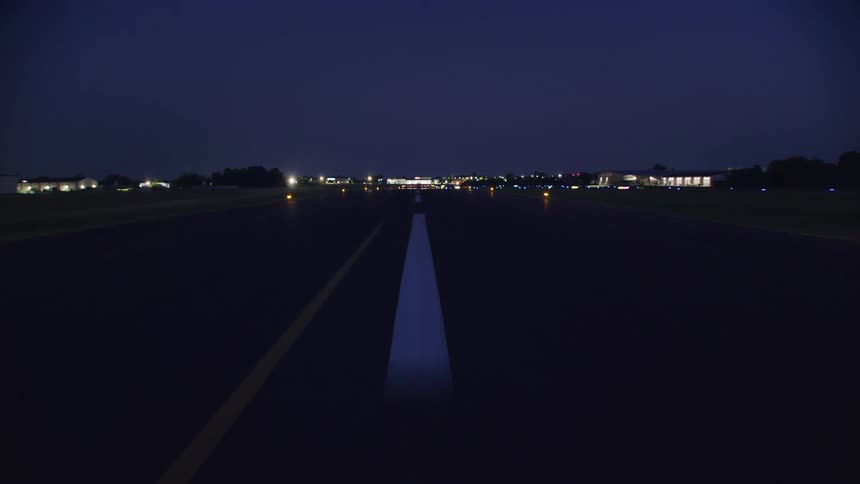 Point of view of an airstrip at night in motion and in sequence taking off